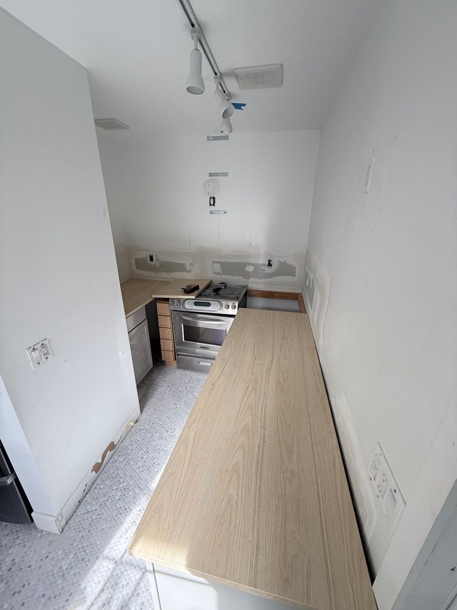 Kitchen wall after the drywall openings were patched